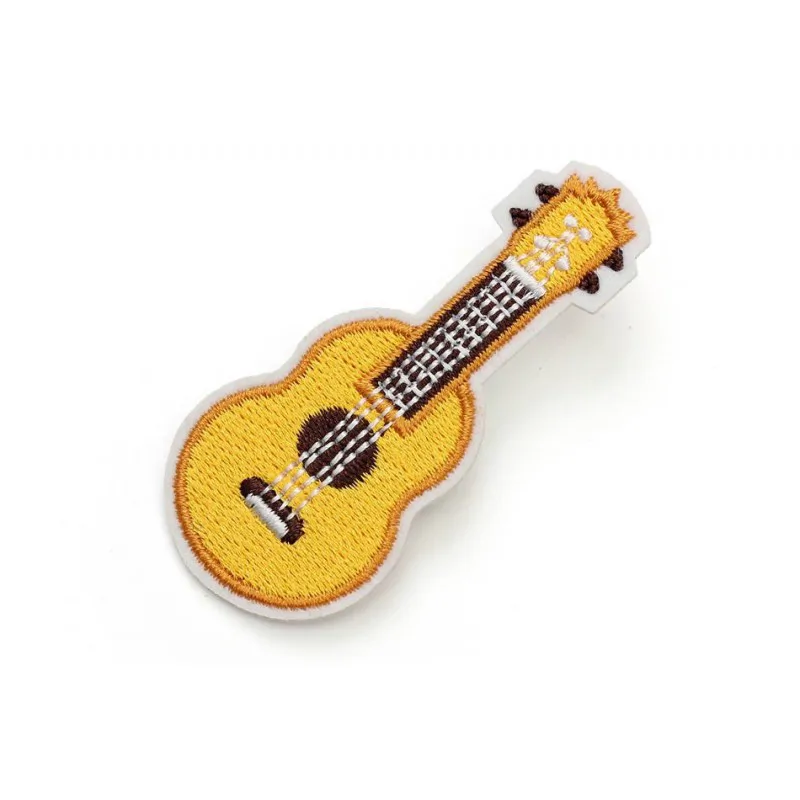 KERA AUdIO Kera AS-007 przypinka gitara żółta